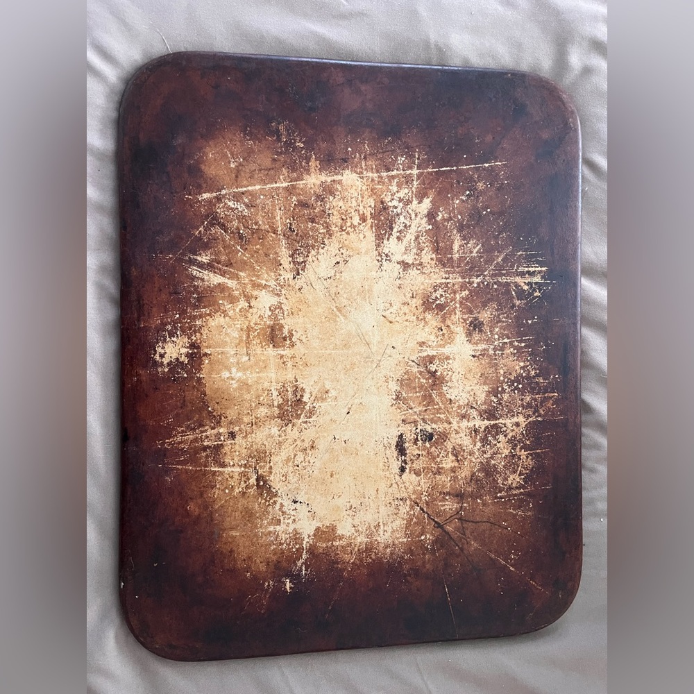 Pampered Chef Stoneware cooking sheet.